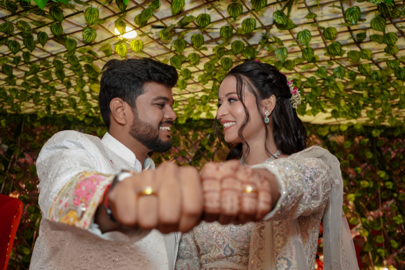 Couple showing playful fist pose during outdoor pre wedding shoot