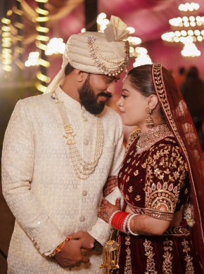 Bride and groom in traditional attire posing during wedding ceremony