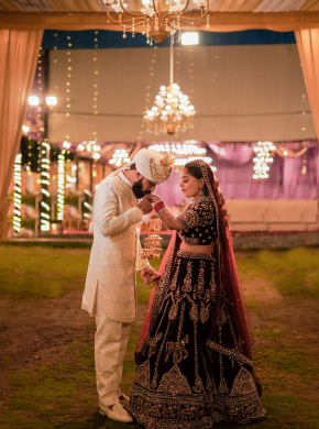 Bride walking under beautiful floral canopy during wedding ceremony