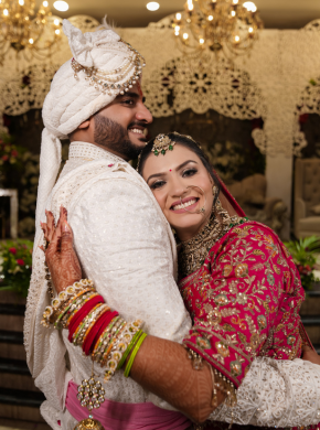 Bride and groom hugging during emotional post-wedding moment