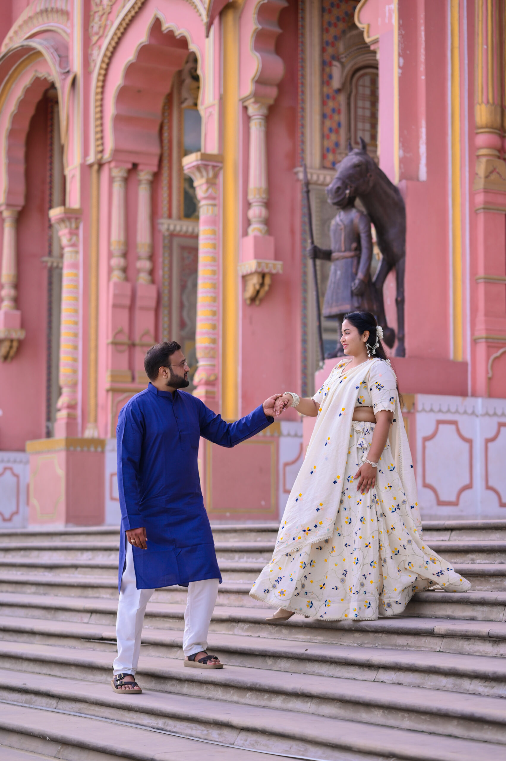 Couple posing at heritage palace location for royal themed pre wedding photography